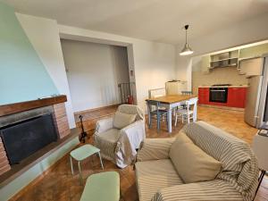 a living room with a couch and chairs and a table at A Casa Nostra in Montopoli in Val dʼArno