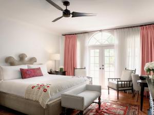 a bedroom with a bed and a ceiling fan at Casa Faena Miami Beach in Miami Beach