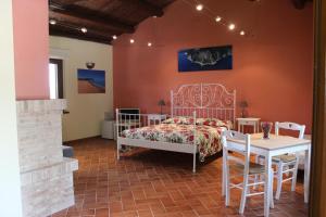 Postel nebo postele na pokoji v ubytování Casa vacanze La Foresteria