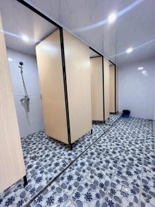 a row of lockers in a room with a tile floor at Sunflower House - Ha Giang Loop Tour in Bản Kin