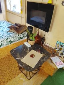 a table with a piece of paper on it in a room at Alojamento 4 in Monção