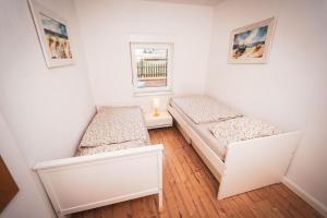 Ένα ή περισσότερα κρεβάτια σε δωμάτιο στο Gemütliches Ferienhaus auf Gut Johannesberg