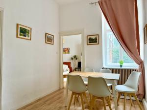 a dining room with a table and chairs at Renovated Spacious Apartment with Free Parking in Vienna