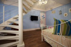 a kids room with a bunk bed and a staircase at White Rabbit in Hualien City