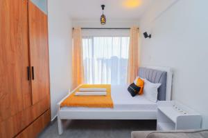 Ένα ή περισσότερα κρεβάτια σε δωμάτιο στο Comfort Homes