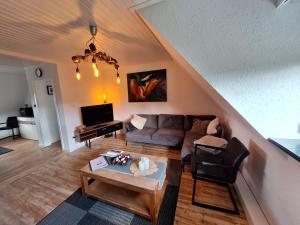 a living room with a couch and a table at Just-ed Weeze in Weeze