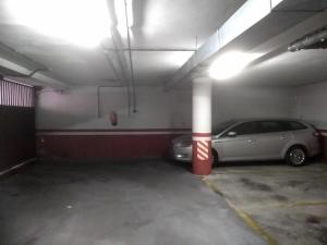 a parking garage with a car parked in it at Skyline de Leon con opcion de parking in León