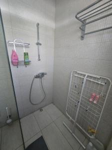 a bathroom with a shower stall with a shower at Lazuli Seafront Beach House Nr18 in Larnaca +37 photos