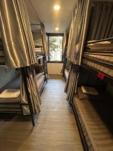 a room with a bunch of bunk beds at Rom Casa Hostel Da Nang in Danang
