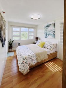Ένα ή περισσότερα κρεβάτια σε δωμάτιο στο Modern Cozy 2BR Smart Lock Condo with Netflix 4K and YouTube Premium at Seawind