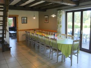 a kitchen and dining room with a table and chairs at Elegant Bevercé Escape in Malmedy