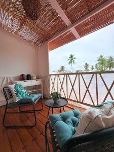 a living room with a view of the ocean at The Blue Doors- Siargao in General Luna