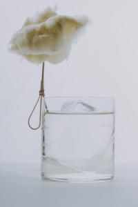 a flower is sticking out of a glass jar at Boutique Guest House Coco in Plovdiv +65 photos