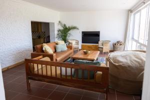 a living room with a couch and a table at Casa Del Sol Cottage in McGregor