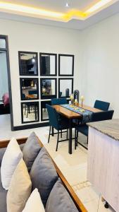 a living room with a table and a couch at Ikamba Homes-Munyonyo in Kampala