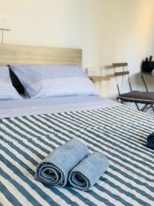 Postel nebo postele na pokoji v ubytování Hello Verona Rooms