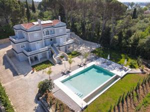 an aerial view of a house with a swimming pool at The Seven Islands Deluxe Apartments in Gouvia