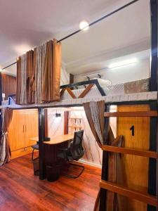 a room with a desk and a bunk bed at Davao Condo Bed Space - Safe, Affordable & Comfy in Davao City