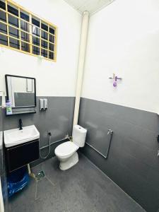 a bathroom with a toilet and a sink at Effa Homestay in Sungai Petani +19 photos