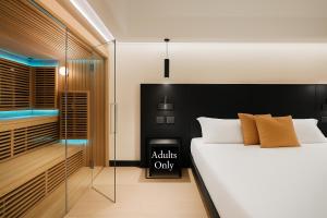 a bedroom with a bed and a walk in closet at Dream Suite Trevi in Rome