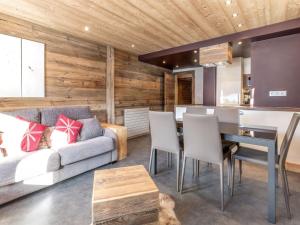 a living room with a couch and a table at Appartement 4★, 5 pers, ski au pied, proche centre - FR-1-304-149 in La Clusaz