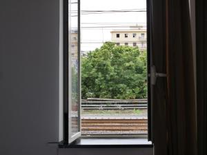 an open window with a view of a train track at Rooms Piramide in Rome