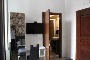 a room with a bathroom with a sink and a mirror at Rooms Piramide in Rome