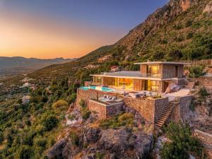 a house on the side of a mountain at Villa Deep Blue in Messinia in Verga Kalamata