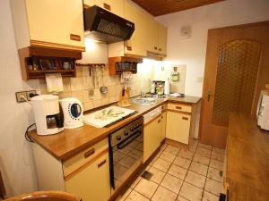 a small kitchen with a sink and a stove at Apartment in Liebetig near Gerlitzen Ski Area in Feldkirchen in Kärnten