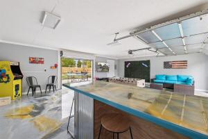 a large kitchen with a large blue counter top at Pet Friendly, Gated Backyard, Game room, Hot Tub in New Baltimore