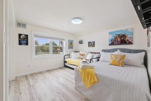 a bedroom with a large bed and a couch at Pet Friendly, Gated Backyard, Game room, Hot Tub in New Baltimore +35 photos