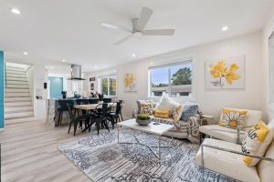 a living room with a couch and a table at Pet Friendly, Gated Backyard, Game room, Hot Tub in New Baltimore