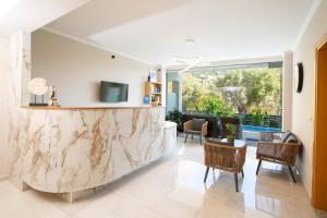 a living room with a large marble counter at Zisis Suites in Nydri