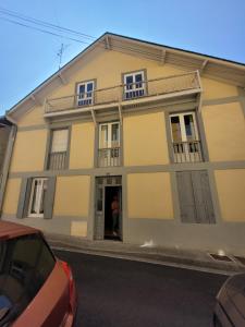 a man standing in the doorway of a house at LES AGUDES Télécabine 10min à pied in Cauterets