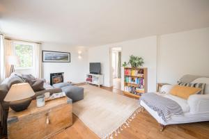 a living room with a couch and a table at The Bantams, Monk Soham in Bedfield