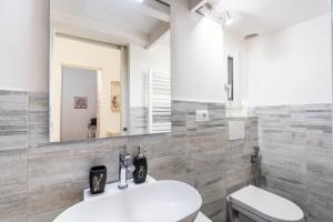 a bathroom with a toilet and a sink and a mirror at Firenze Center - 5min to Duomo, Station - Wifi and AC in Florence +15 photos