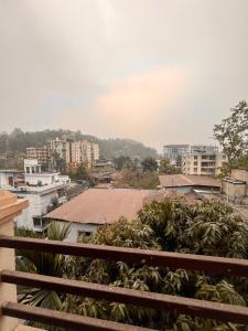 a view of a city from a balcony at Vortex homes in Guwahati