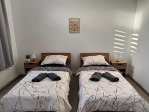 Ένα ή περισσότερα κρεβάτια σε δωμάτιο στο Blunest Apartment 1