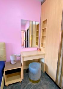a dressing room with a vanity and a mirror at Chalong pool villa in Ban Na Bon +12 photos