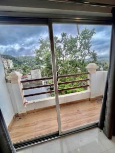 a view from the balcony of a house at Vortex homes in Guwahati +6 photos