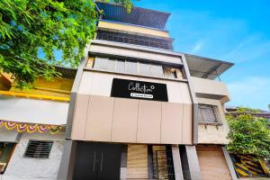 a building with a black sign on it at Collection O Ambedkar Chowk Ulhasnagar in Mumbai +25 photos