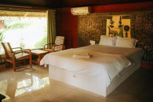 Postel nebo postele na pokoji v ubytování Misty Night Wayanad Pool Resort + 54 fotografií