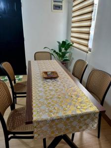 a table with a napkin on top of it at Elisa's 3BR Home with Pool in San Pablo +1 photo