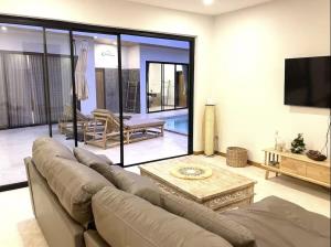 Posezení v ubytování Villa YOLO 3 Chambres avec Piscine Privative