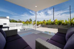 an open living room with a table and chairs at Luxury Pool Villa Samui - Elabel in Amphoe Koh Samui