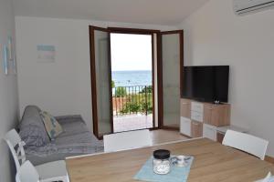 Un televizor și/sau centru de divertisment la Villa Porto Frailis G&C