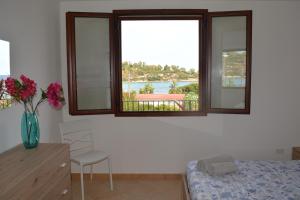 Un pat sau paturi într-o cameră la Villa Porto Frailis G&C