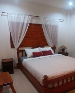 Una cama o camas en una habitación de Baan Farang