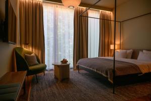 Postel nebo postele na pokoji v ubytování Grand Hotel Terminus