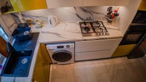 Η κουζίνα ή μικρή κουζίνα στο Les Brisants 21 - Saint-Gilles Les Bains